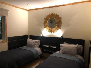 Postel nebo postele na pokoji v ubytování Villa Mafini