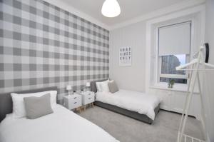 Ένα ή περισσότερα κρεβάτια σε δωμάτιο στο The Warren Apartment