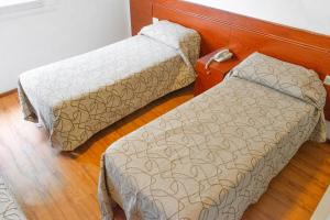 מיטה או מיטות בחדר ב-Hotel Traful