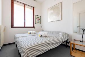 Ліжко або ліжка в номері ALTIDO Cosy flat with terrace
