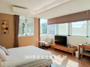 TV a/nebo společenská místnost v ubytování 小雅民宿 Oo自助入住旅店oO