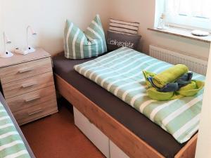 Postel nebo postele na pokoji v ubytování Strandnest