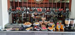 a buffet of food and drinks on a counter at Hotel Spa Machupicchu in Tacna