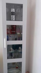 a door to a pantry filled with food at 1 apartment with 2rooms in München in Munich