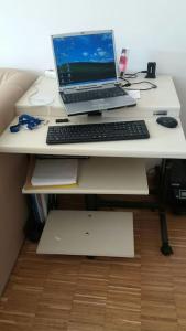 a laptop computer sitting on top of a desk at 2 Rooms virgin 1 apartment in München in Munich