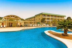 a large swimming pool in front of a hotel at Plantation East II in Gulf Shores