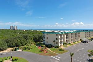 an aerial view of a hotel with the ocean in the background at Plantation East II in Gulf Shores