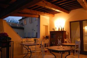 a room with tables and chairs and a building at La Corte in Tolentino
