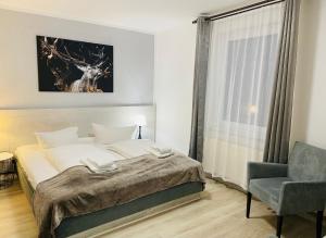 Postel nebo postele na pokoji v ubytování Harzhotel Warnstedter Krug