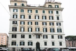 a large white building with a lot of windows at Vaticano Luxury Guest House in Rome