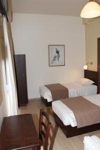 Postel nebo postele na pokoji v ubytování Rea Hotel