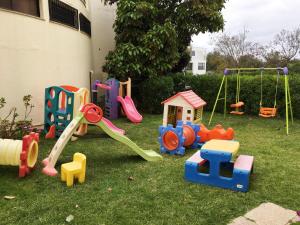 a bunch of toys on the grass in a yard at Clube Alvorférias in Alvor