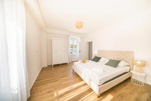 Posteľ alebo postele v izbe v ubytovaní Central Seaside Residence