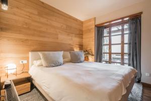 A bed or beds in a room at Muntanyos by Totiaran