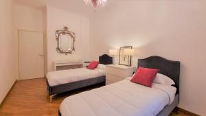 En eller flere senge i et værelse på Palazzo Crispi - Boutique Apartment