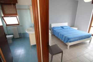 Postel nebo postele na pokoji v ubytování Attico Del Vico