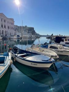 a group of boats are docked in a harbor at Casa Porto in Piran