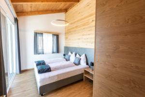 Posteľ alebo postele v izbe v ubytovaní Seisen Almchalet