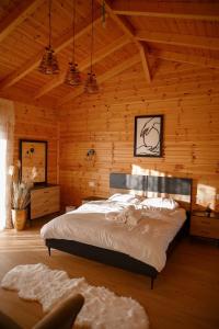 a bedroom with a bed in a wooden cabin at צימר נור החרמון in Majdal Shams +14 photos