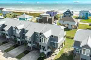 an aerial view of houses and the beach at Casa Del Alba in Galveston