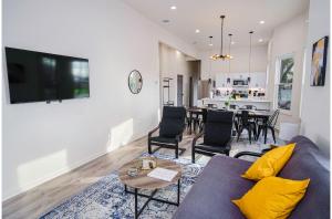 a living room with a couch and a table at Magnificent 4BR Near Famous Riverwalk and Downtown in San Antonio