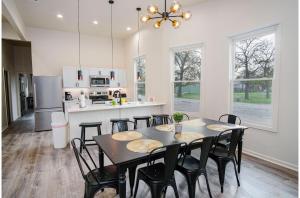 a kitchen and dining room with a table and chairs at Magnificent 4BR Near Famous Riverwalk and Downtown in San Antonio