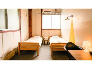 Ένα ή περισσότερα κρεβάτια σε δωμάτιο στο fan! -ABURATSU- Sports Bar & HOSTEL - Vacation STAY 78456v