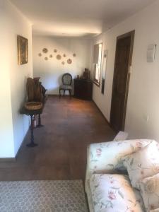 a living room with a couch and a chair at Refugio Gaia in Chillán +18 photos