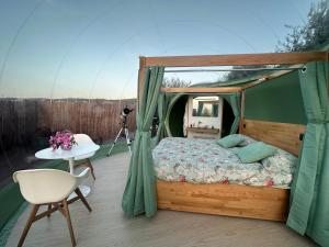 a bed in a tent on a deck at Villa Ulivi in Filiano +38 photos