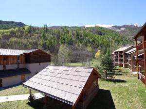 an overhead view of a building with a metal roof at Appartement Pelvoux, 2 pièces, 6 personnes - FR-1-330G-83 in Pelvoux