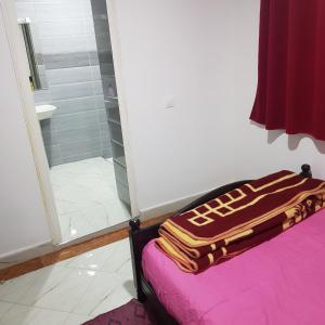 Een bed of bedden in een kamer bij Hotel camping amtoudi