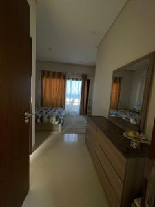 Kuchyň nebo kuchyňský kout v ubytování Sifa Beachfront Apartment