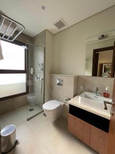 Koupelna v ubytování Sifa Beachfront Apartment