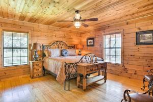 a bedroom with a bed and a wooden ceiling at Cozy New Braunfels Family Cabin with Porch and Views! in New Braunfels