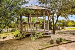 a wooden gazebo in a park with a street light at Cozy New Braunfels Family Cabin with Porch and Views! in New Braunfels