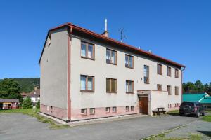 a large white building with a red roof at Apartmán Deštné v Orlických horách 58 in Deštné v Orlických horách