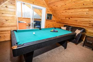 a pool table in a room in a cabin at Lover's Loft in Gatlinburg