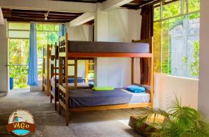 Postel nebo postele na pokoji v ubytování VAGO HOSTEL
