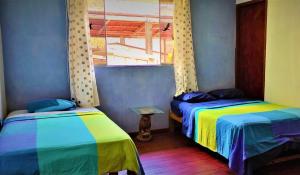 Postel nebo postele na pokoji v ubytování VAGO HOSTEL