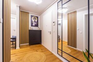 a hallway with a glass door leading to a bedroom at A&V Apartments Wunderschöne Penthouse Wohnung in Moers
