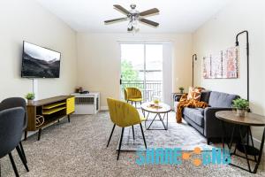 a living room with a couch and a table at Charming Dallas Getaway W Modern Amenities in Dallas