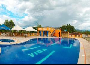 Bazén v ubytování Hostal Campestre Vida Tranquila nebo v jeho okolí