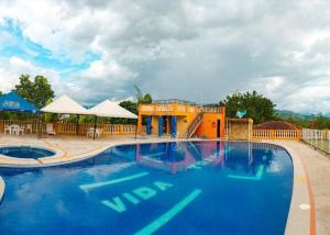 Bazén v ubytování Hostal Campestre Vida Tranquila nebo v jeho okolí