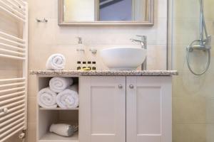 a bathroom with a sink and a shower at Amigdalies in Myrina