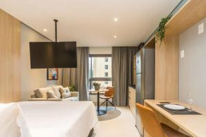 Cozzy Suites Paraíso Hotel客房内的一张或多张床位