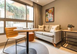 Cozzy Suites Paraíso Hotel的休息区