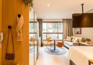 Cozzy Suites Paraíso Hotel的休息区