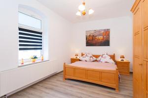 a bedroom with a bed and a window at Apartment Zoey in Auerbach