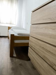 a small bedroom with a bed and a window at Holiday Home Aleksandar Brzece Kopaonik in Brzeće