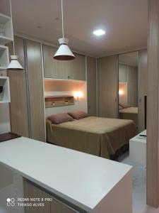 Postel nebo postele na pokoji v ubytování Flat Residencial Simas